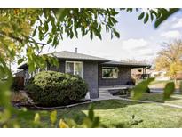 Exterior view of a charming ranch home with a well-maintained lawn at 2259 Osceola St, Denver, CO 80212