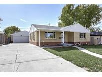 Front view of a charming ranch home with a driveway and landscaping at 4720 E Mexico Ave, Denver, CO 80222