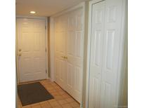 Entryway with coat closets and tile flooring at 12348 W Dorado Pl # 104, Littleton, CO 80127