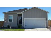 Two-car garage and front entrance of a new home at 914 Savona Ave, Fort Lupton, CO 80621