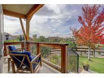 Relaxing patio with wooden chairs and scenic neighborhood views at 7030 S Buchanan St, Aurora, CO 80016