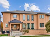 Stunning three-story home with a neutral color palette and modern architectural details at 3575 E Cedar Ave, Denver, CO 80209