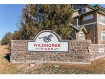 Stone sign welcomes you to Wildhorse Ridge community at 5800 Tower Rd # 503, Denver, CO 80249