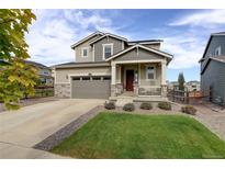 Two-story home with attached garage and landscaped front yard at 4861 St Vrain Rd, Firestone, CO 80504