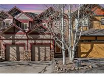 Three-unit townhome complex with attached garages and mountain views at 2120 Major Anderson Dr # 2120, Georgetown, CO 80444