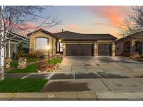 Beautiful ranch home with 2-car garage, landscaping, and a welcoming front porch at 15232 Uinta St, Thornton, CO 80602