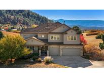 Two-story house with a large yard and mountain views at 4517 Tallyrand Cir, Castle Rock, CO 80104