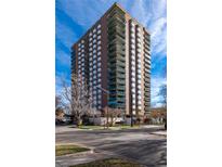 Ten-story residential building with brick and white accents at 550 E 12Th Ave # 907, Denver, CO 80203