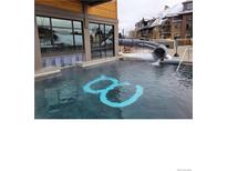 Community pool with water slide and relaxing area at 1627 Ski Hill Rd # 2236Eghi, Breckenridge, CO 80424