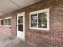 Exterior view of a brick building with a single entrance at 6800 E Tennessee Ave # 232, Denver, CO 80224