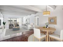 Spacious living and dining area with hardwood floors at 8060 E Girard Ave # 419, Denver, CO 80231
