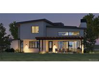 Modern home exterior with sleek design and outdoor dining area at 5292 Lions Paw St, Castle Rock, CO 80104
