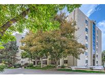 Exterior view of a multi-story building with landscaping at 13890 E Marina Dr # 111, Aurora, CO 80014