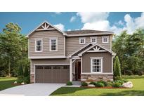 Two-story house with beige siding, stone accents, and a two-car garage at 819 Goodrich Peak St, Erie, CO 80516