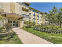 Building exterior showcasing landscaping and entrance at 585 S Alton Way # 2C, Denver, CO 80247