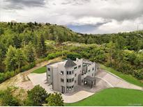 Castle-style home with expansive views and a large backyard at 5380 N Lariat Dr, Castle Rock, CO 80108