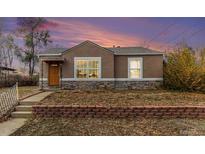 Charming ranch home with landscaped yard and brick accents at 4545 Raritan St, Denver, CO 80211