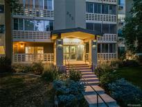 Night view of apartment building exterior with landscaping at 350 S Clinton St # 7A, Denver, CO 80247