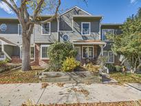 Two-story townhome with brick and gray siding at 1948 S Balsam St, Lakewood, CO 80227