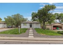 Charming ranch home with landscaped yard and detached garage at 7946 Joan Dr, Denver, CO 80221