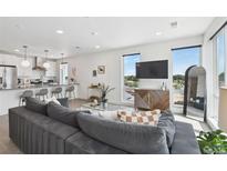 Bright living room with modern furniture and city views at 1898 S Bannock St # 512, Denver, CO 80223