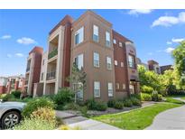 Modern condo building with attractive landscaping and ample parking at 14321 E Tennessee Ave # 1-105, Aurora, CO 80012