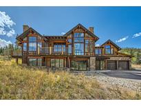 Stunning two-story home with large windows and mountain views at 964 Alpensee Dr, Breckenridge, CO 80424