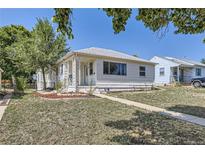 Ranch-style home with a front yard and walkway at 175 S Clay St, Denver, CO 80219