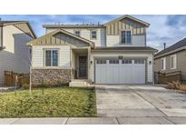 Two-story home with a large garage and stone accents at 6645 Dry Fork Dr, Frederick, CO 80516