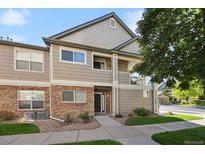 Two-story condo building with stone and siding exterior at 4385 S Balsam St # 3-101, Littleton, CO 80123