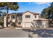 Two-story house with attached two-car garage and solar panels at 22141 Chippewa Ln, Golden, CO 80401