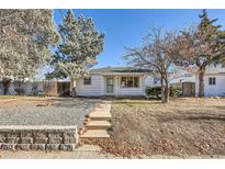 Charming single story home with a well-maintained front yard and walkway at 1340 Clinton St, Aurora, CO 80010