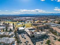 Aerial view of Windsor Gardens community, showing buildings, landscaping, and golf course at 650 S Clinton St # 6D, Denver, CO 80247