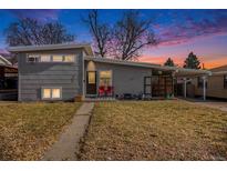 Gray ranch house with a landscaped yard and walkway at 1654 S Perry St, Denver, CO 80219
