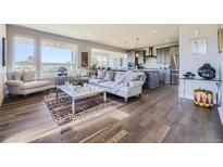 Spacious living room with hardwood floors and modern decor at 4673 W 50Th Pl, Denver, CO 80212