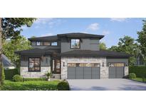 Modern two-story home with gray siding, stone accents, and a two-car garage at 882 Eldorado Dr, Superior, CO 80027