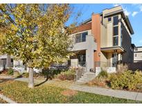 Modern two-story home with landscaped yard and attached two-car garage at 30 S Oneida St, Denver, CO 80230