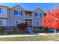 Two-story townhome with a charming front porch at 1221 Bistre St, Longmont, CO 80501