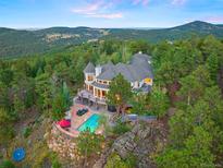 Luxury home with pool and mountain views at 29115 Summit Ranch Dr, Golden, CO 80401
