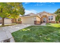 Ranch style home with two-car garage and nicely landscaped yard at 15932 Deer Ridge Dr, Morrison, CO 80465