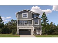 Two-story home with gray siding, stone accents, and a two-car garage at 2068 S Haleyville Way, Aurora, CO 80018