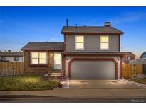 Two-story house with attached garage and landscaping at 4824 Chandler Ct, Denver, CO 80239