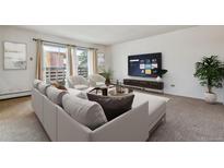 Living room with comfortable seating and smart TV at 495 S Dayton St # 10C, Denver, CO 80247