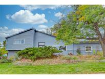 Ranch-style home with gray siding and landscaping at 2059 Goldenvue Dr, Golden, CO 80401