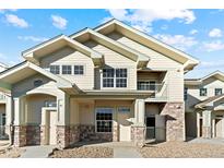 Two-story townhome with stone and siding at 18633 Stroh Rd # 2-103, Parker, CO 80134