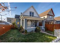 Charming craftsman home with gray siding, inviting porch, and well-manicured lawn at 2913 N Marion St, Denver, CO 80205