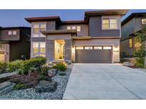 Two-story home, gray siding, landscaping at 6712 Golden Sill Ct, Castle Pines, CO 80108