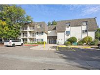 Exterior view of a two-story apartment building with parking at 5995 E Iliff Ave # 307, Denver, CO 80222