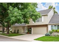 Two-story townhome with attached garage and landscaping at 4505 S Yosemite S St # 371, Denver, CO 80237