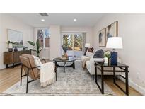 Spacious living room with sliding glass doors leading to a private outdoor patio at 1133 Race St # 1B, Denver, CO 80206